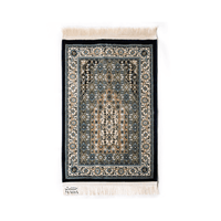 Islamic prayer rug with traditional heritage-style design featuring an ornate mihrab pattern and decorative border
