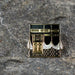 Gold and black stainless steel pin inspired by the door of the Kaaba with detailed Islamic architectural design
