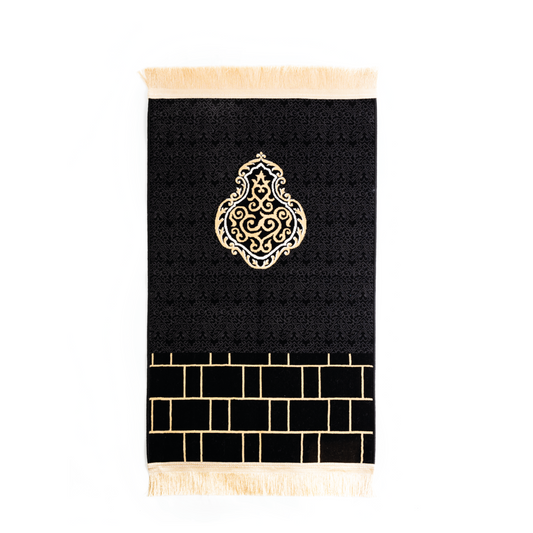 Black and gold prayer rug inspired by the Kiswah of the Kaaba with woven geometric and brick pattern design
