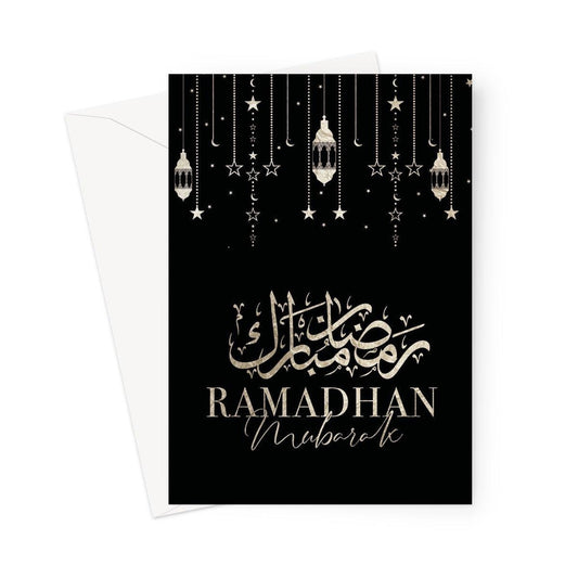 Ramadhan Mubarak Islamic greeting card featuring elegant Arabic calligraphy with hanging lanterns, crescent moons, and stars on a black background, designed by Ilhaam