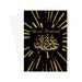 Islamic Umrah greeting card featuring gold Arabic calligraphy on a black background with the message “Umrah Mubarak”, designed by Ilhaam
