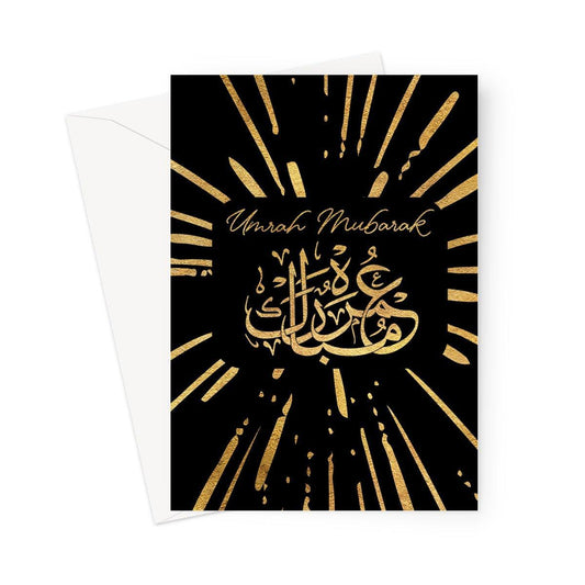 Islamic Umrah greeting card featuring gold Arabic calligraphy on a black background with the message “Umrah Mubarak”, designed by Ilhaam