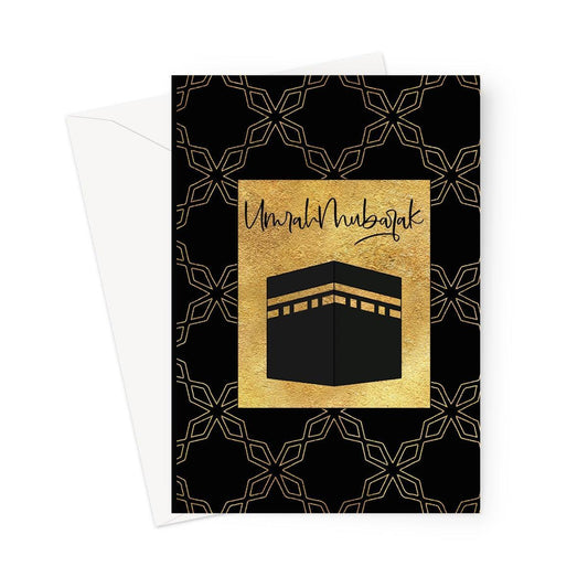 Umrah Mubarak Islamic greeting card featuring the Kaaba in gold with geometric pattern on a black background, designed by Ilhaam