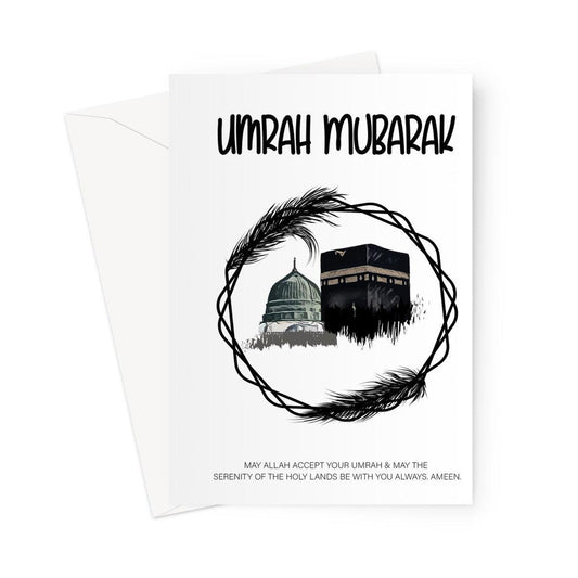 Islamic Umrah greeting card featuring a circular black wreath design with illustrations of the Kaaba and Masjid an-Nabawi, with the message “Umrah Mubarak”, designed by Ilhaam